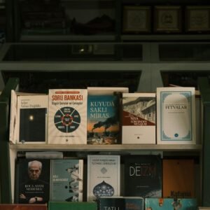 A bookshelf displaying a variety of books in a bookstore setting.
